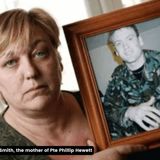 Image of woman holding photograph of man in army uniform with caption saying "Image of Susan Smith, the mother of Pte Phillip Hewett"